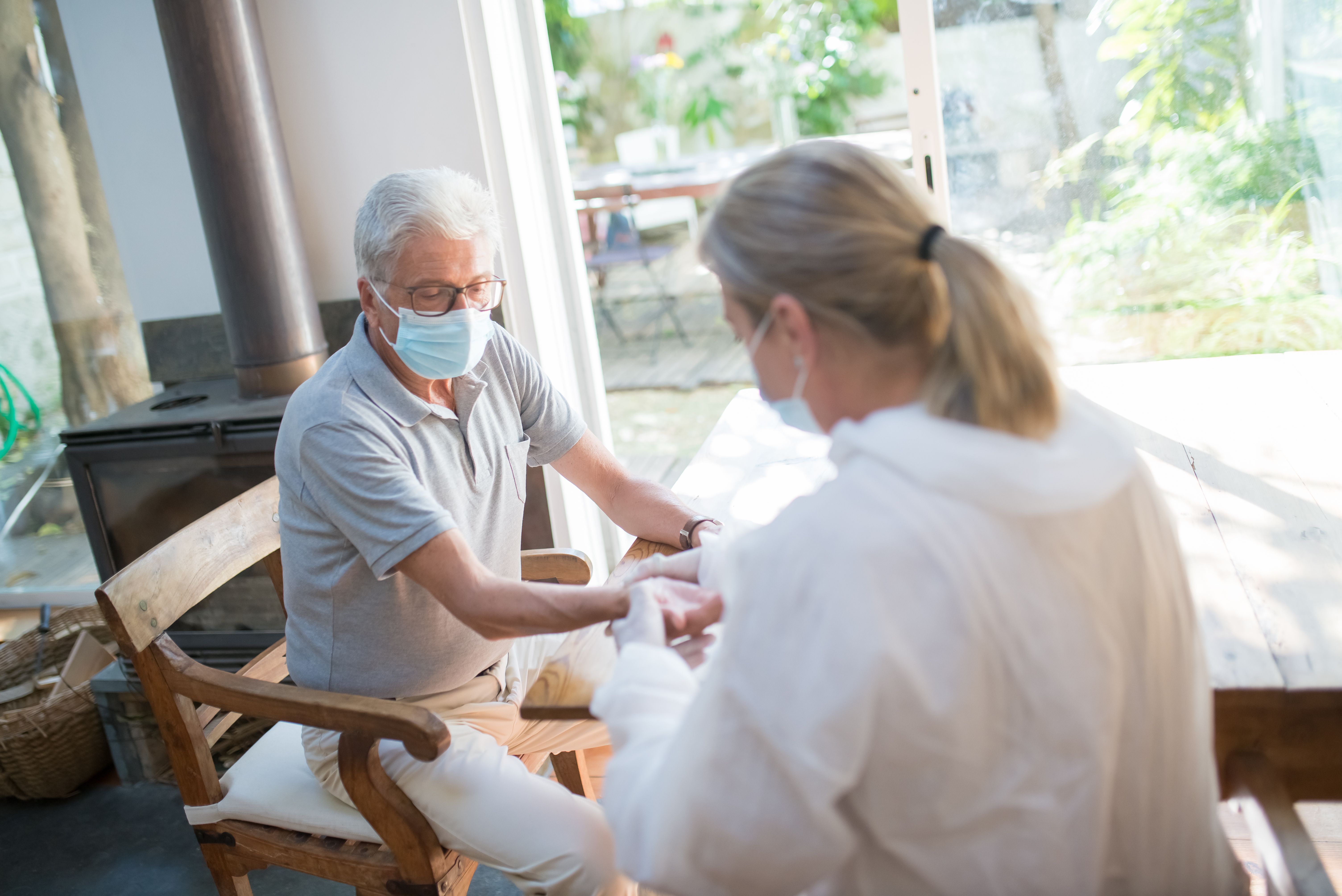 Professional caregiver providing home health services